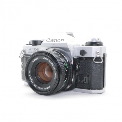 Used Canon AE-1 35mm SLR, silver with 50mm lens Used Canon AE-1 35mm SLR, silver with 50mm lens